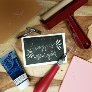 Explore the art of printmaking. Printmaking supplies on table